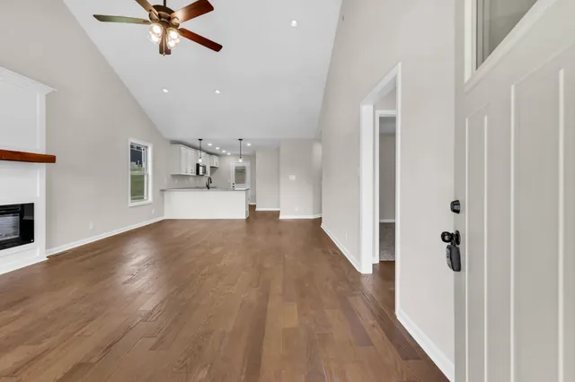 a view of a kitchen with a sink and a refrigerator
