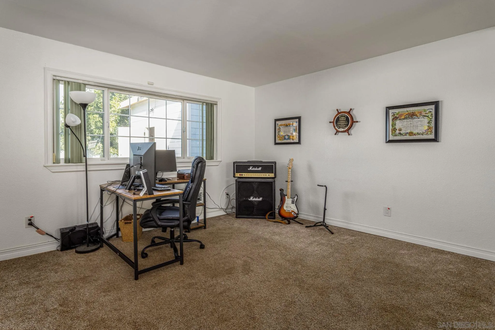 532 Kempton Street Spring Valley, CA 91977 - Photo 13 of 30 a view of a workspace with furniture and a window