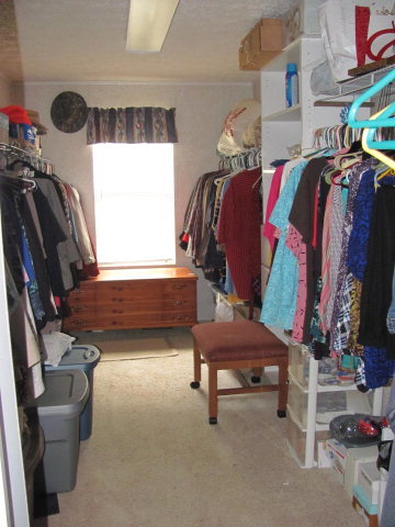 100 Cork Road, Unit 1 2 Forsyth, GA 31029 - Photo 14 of 24 a view of walk in closet with clothes and shoes