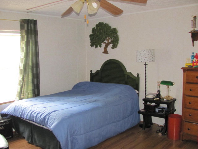 100 Cork Road, Unit 1 2 Forsyth, GA 31029 - Photo 3 of 24 a bedroom with a bed and dresser