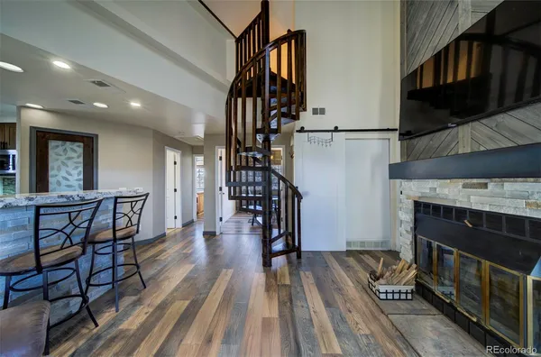 a view of entryway livingroom and hall with wooden floor
