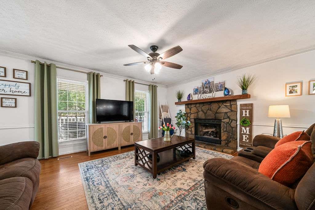 7 College View Drive Southwest Rome, GA 30161 - Photo 11 of 49 a living room with furniture and a fireplace