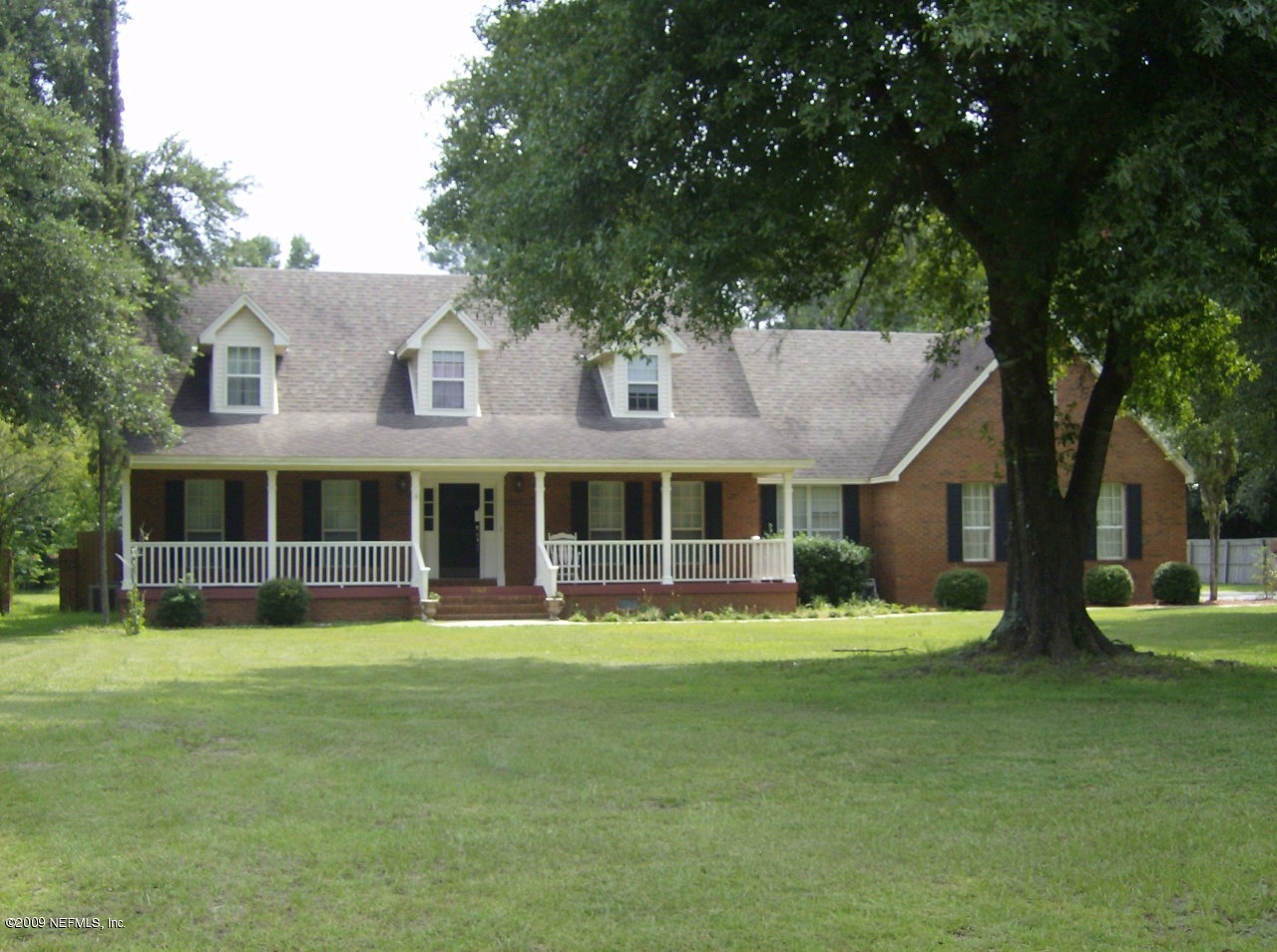 55023 Deer Run Road Callahan, FL 32011 - Photo 1 of 15 a view of a house with a yard porch and sitting area