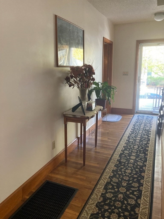 60 Berkeley Street, Unit 1 Somerville, MA 02143 - Photo 5 of 11 a living room with furniture and a wooden floor