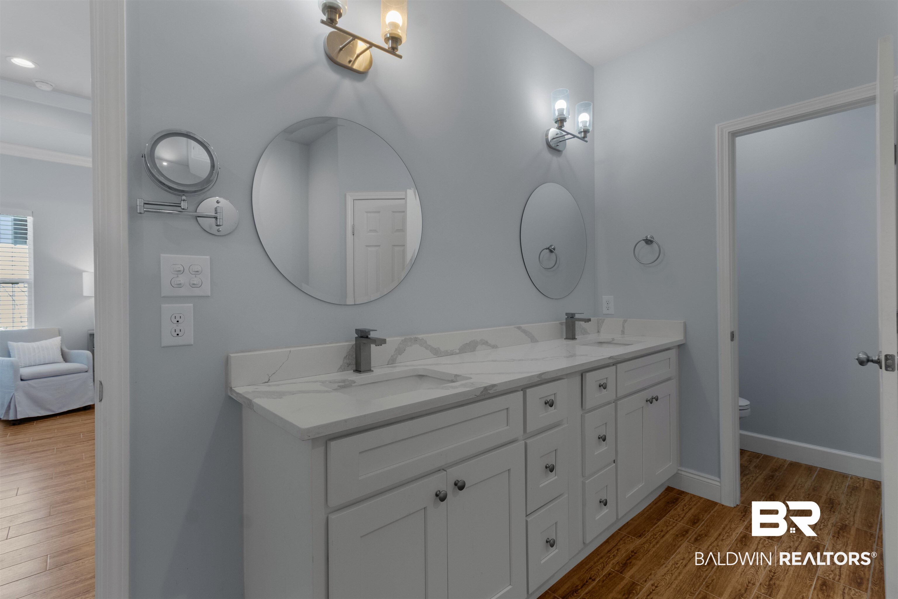 927 Periwinkle Lane Foley, AL 36535 - Photo 10 of 26 Double vanity featuring white cabinetry, stone-finish countertops, undermount sinks, and contemporary fixtures