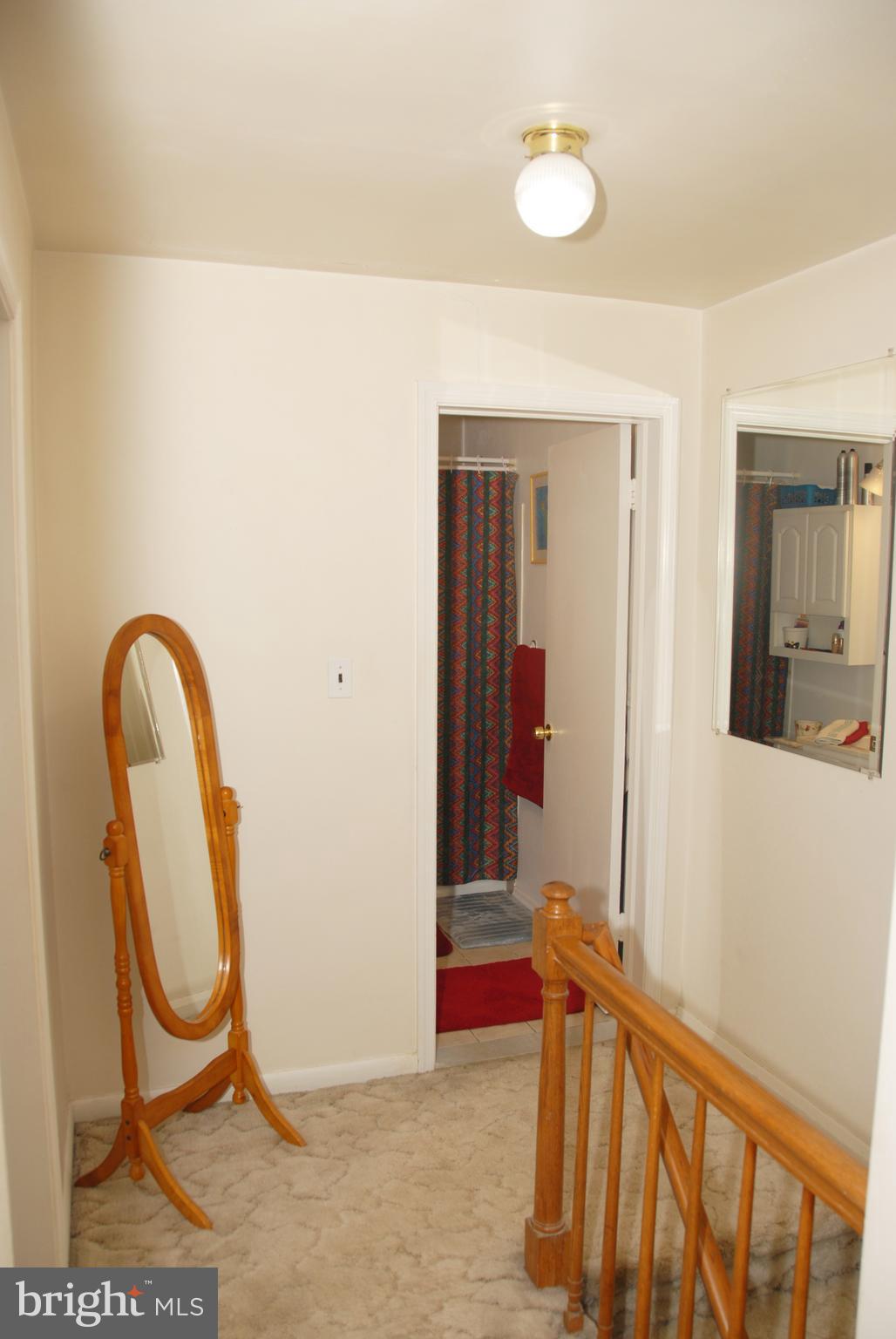 2128 Graythorn Road Baltimore, MD 21220 - Photo 14 of 20 a view of a room with wooden floor and glass door
