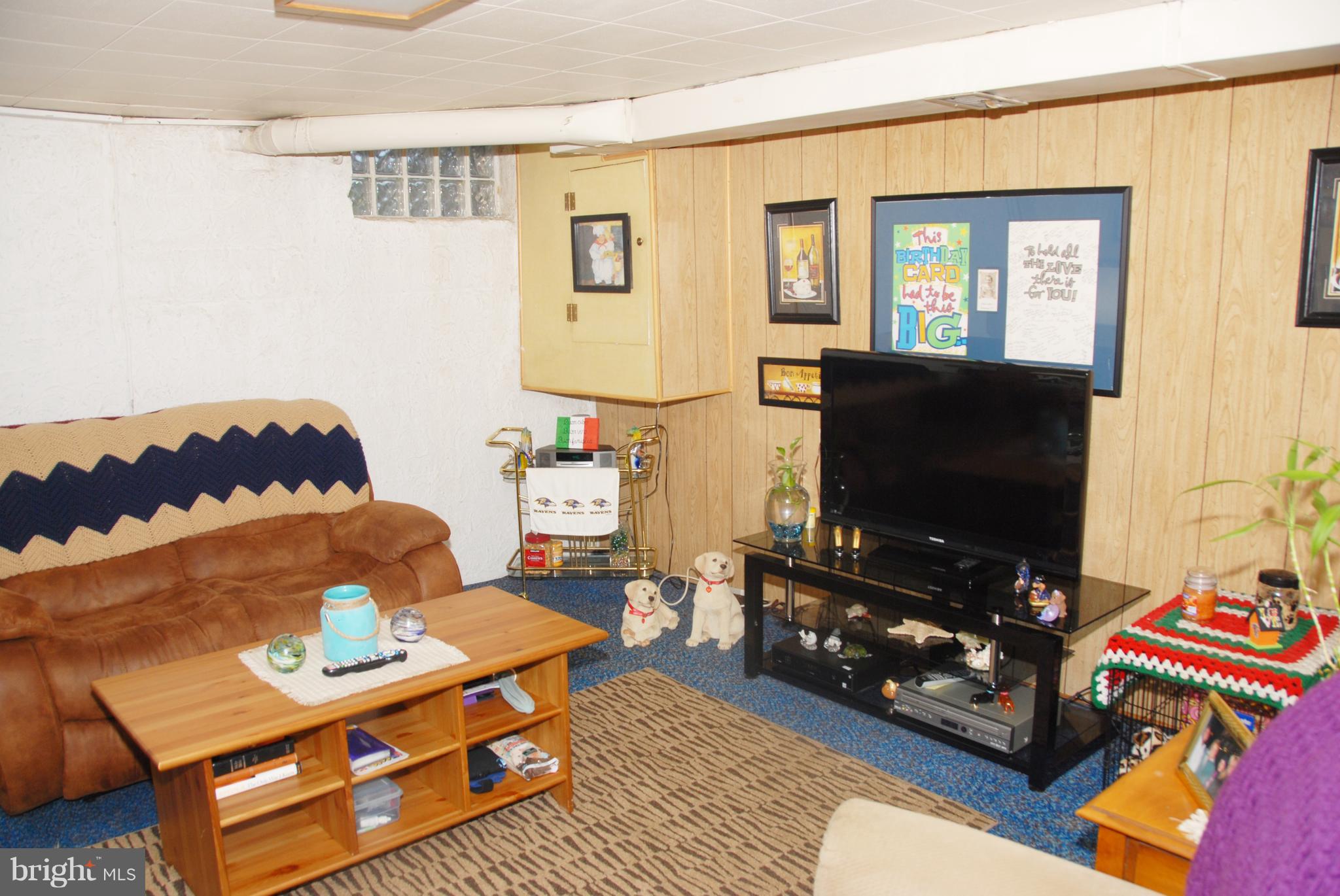 2128 Graythorn Road Baltimore, MD 21220 - Photo 16 of 20 a living room with furniture and a flat screen tv