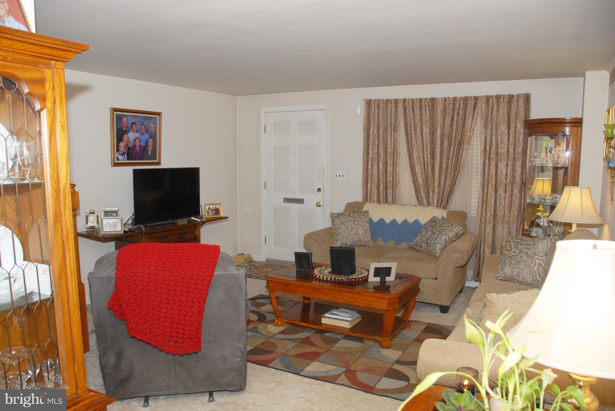 2128 Graythorn Road Baltimore, MD 21220 - Photo 3 of 20 a living room with furniture and a flat screen tv
