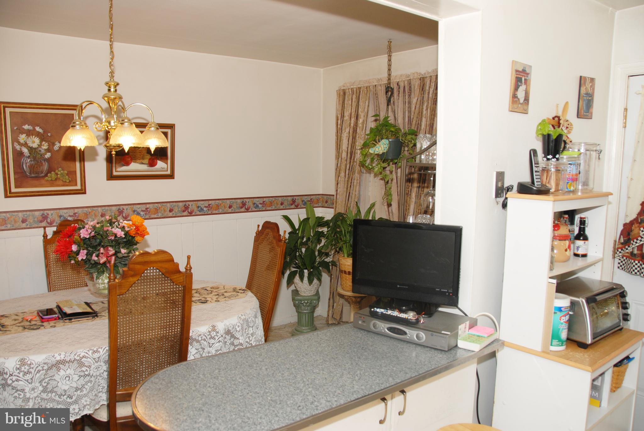 2128 Graythorn Road Baltimore, MD 21220 - Photo 8 of 20 a bedroom with furniture and a flat screen tv
