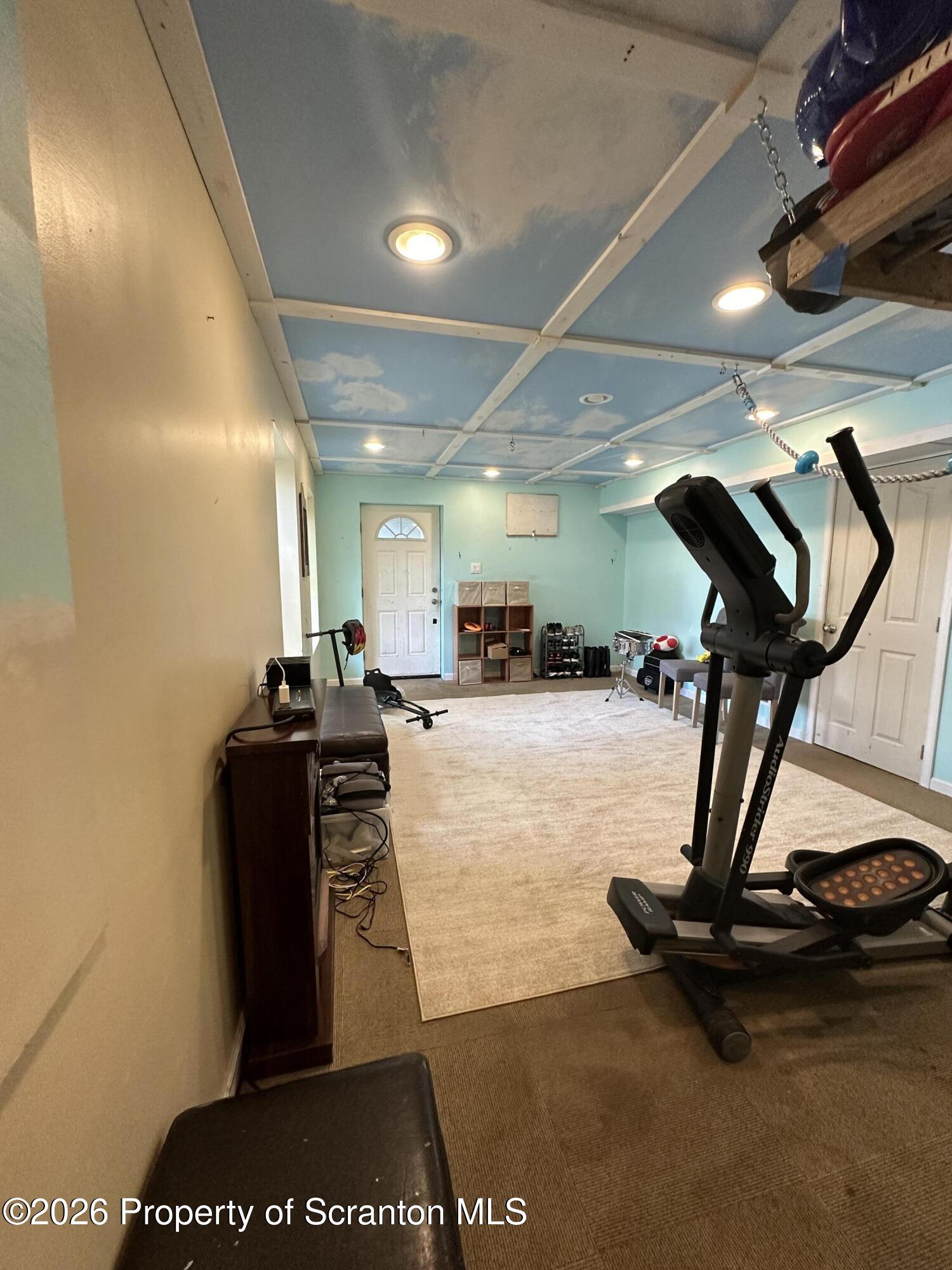 155 Baylor Road Nicholson, PA 18446 - Photo 51 of 53 a room with gym equipment and a table