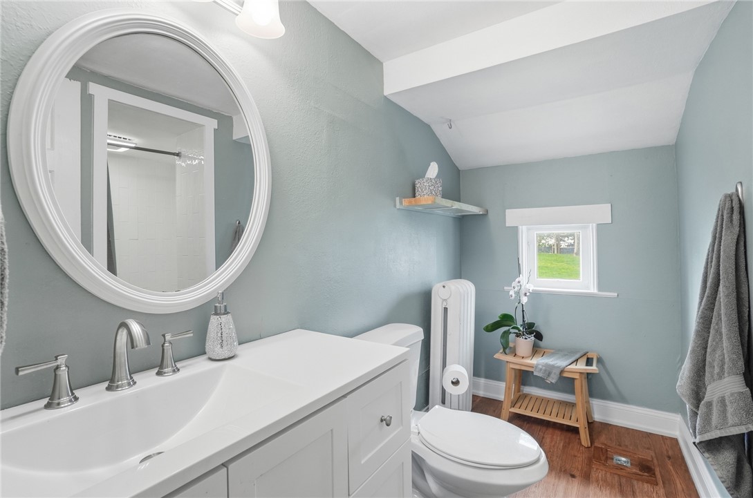 6155 North Union Road Clayton, OH 45315 - Photo 25 of 59 This bright bathroom features a vanity, mirror, and window, creating a refreshing atmosphere.