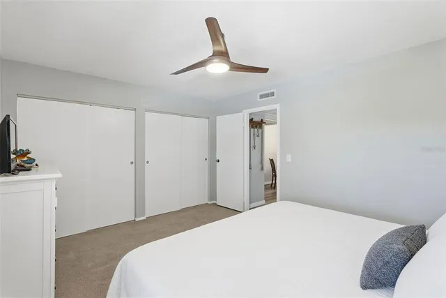 a bathroom with a glass door shower and a sink