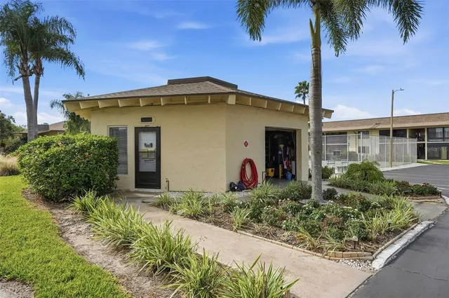 a front view of a house with a garden and street view