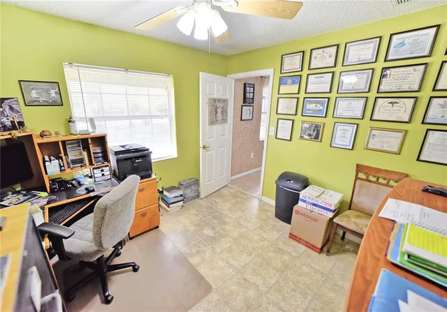 a workspace with furniture and a window