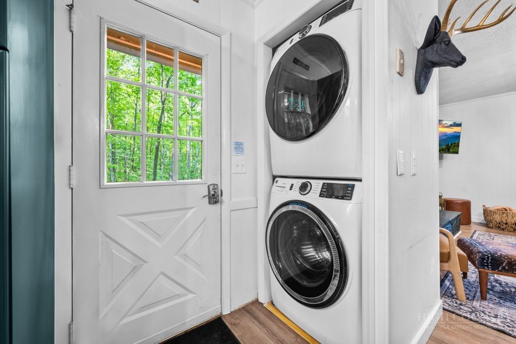 216 Saddle Lane Deep Gap, NC 28618 - Photo 23 of 44 a view of a hallway with washer and dryer