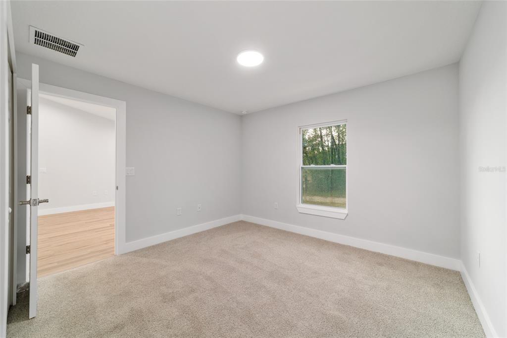 15776 Southwest 27th Lane Ocala, FL 34481 - Photo 25 of 39 an empty room with windows and closet