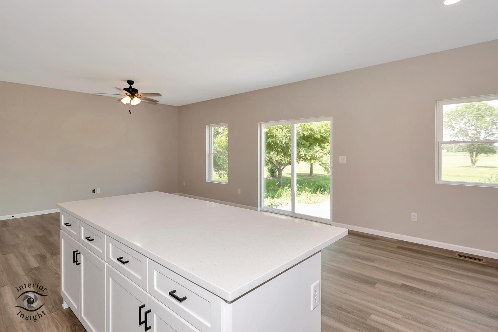 1321 Sioux Turn Kankakee, IL 60901 - Photo 11 of 34 wooden floor in an empty room with a window