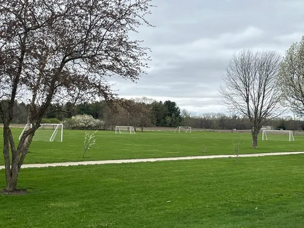 a view of a golf course with a lake