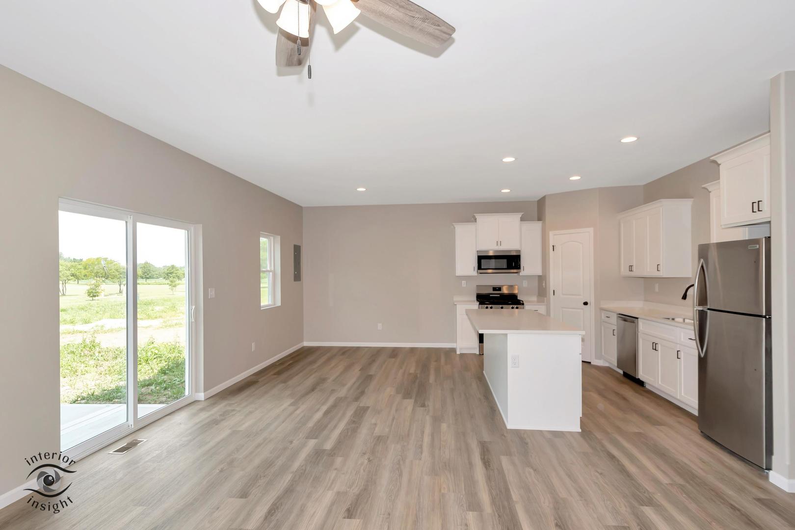 1321 Sioux Turn Kankakee, IL 60901 - Photo 8 of 34 a view of kitchen with stainless steel appliances refrigerator stove and wooden floor