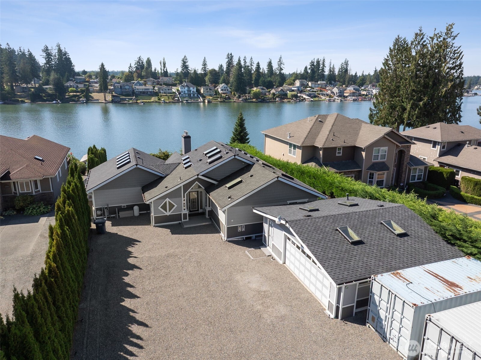 7010 Vandermark Road East Bonney Lake, WA 98391 - Photo 3 of 40 a aerial view of a house with swimming pool and a yard