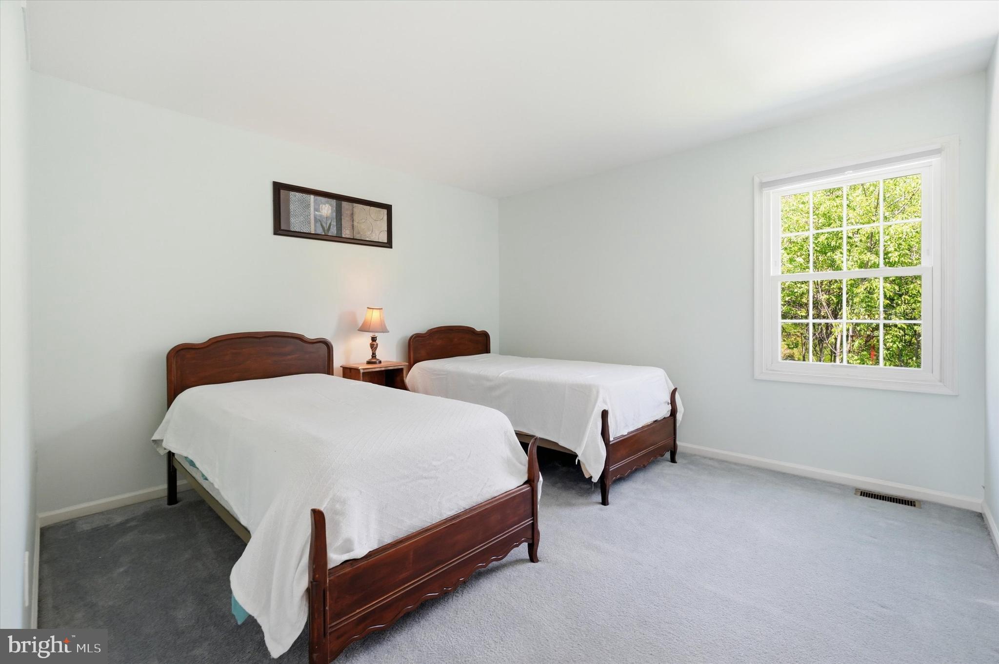 100 Cambridge Road Landenberg, PA 19350 - Photo 22 of 37 a spacious bedroom with two beds and a window