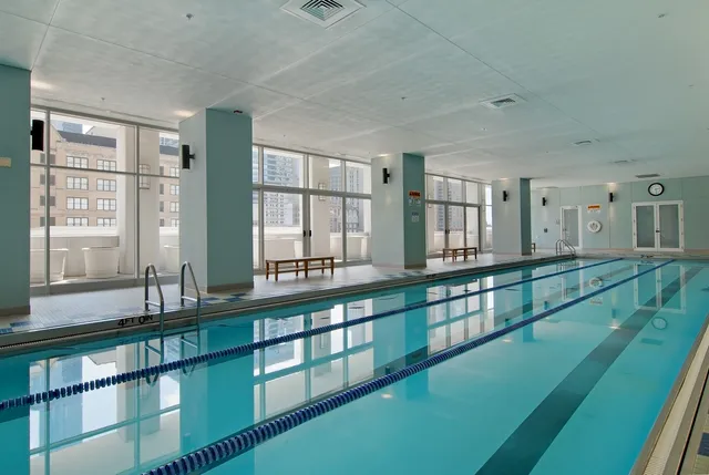 a view of a kitchen with large windows
