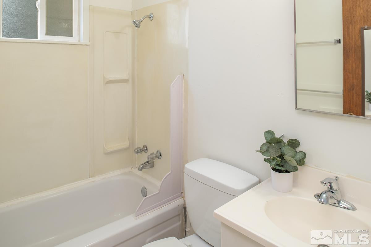 624 Thoma Street Reno, NV 89502 - Photo 30 of 40 a bath room with a sink and a bath tub