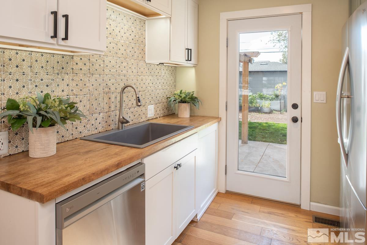 624 Thoma Street Reno, NV 89502 - Photo 5 of 40 a kitchen with a sink and a refrigerator