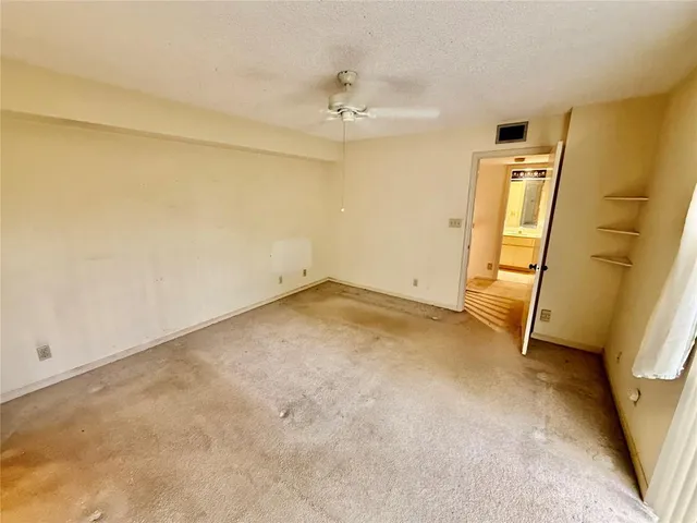 an empty room with a mirror