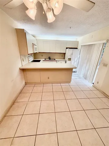 a view of a kitchen with a sink