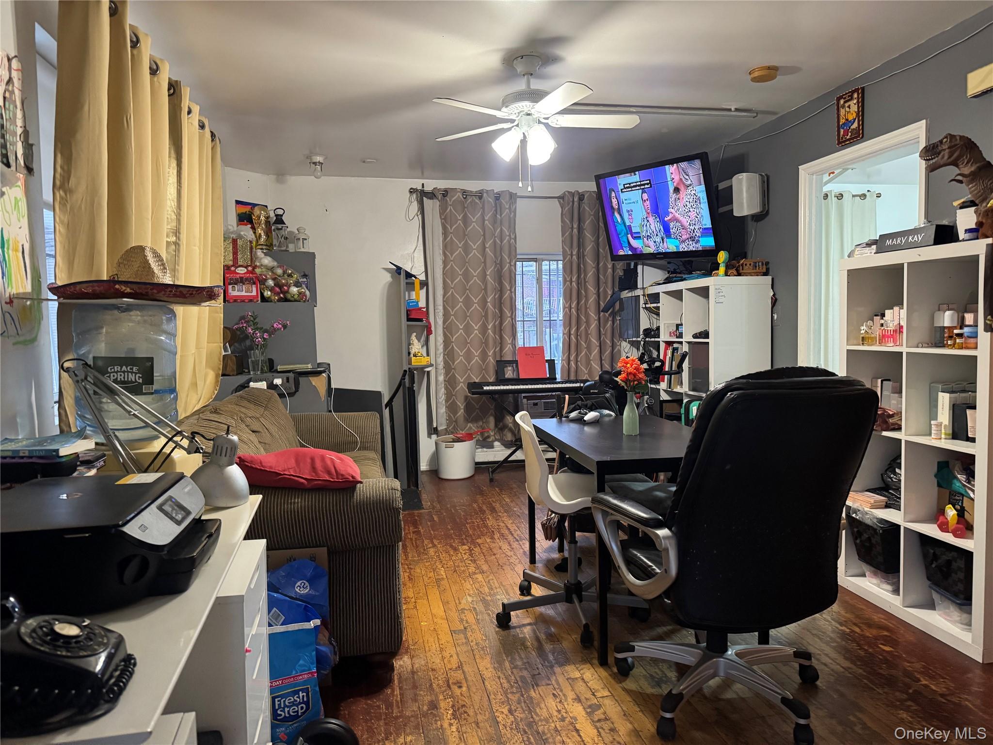 103-25 Alstyne Avenue Queens, NY 11368 - Photo 11 of 22 a view of a workspace with furniture and a flat screen tv