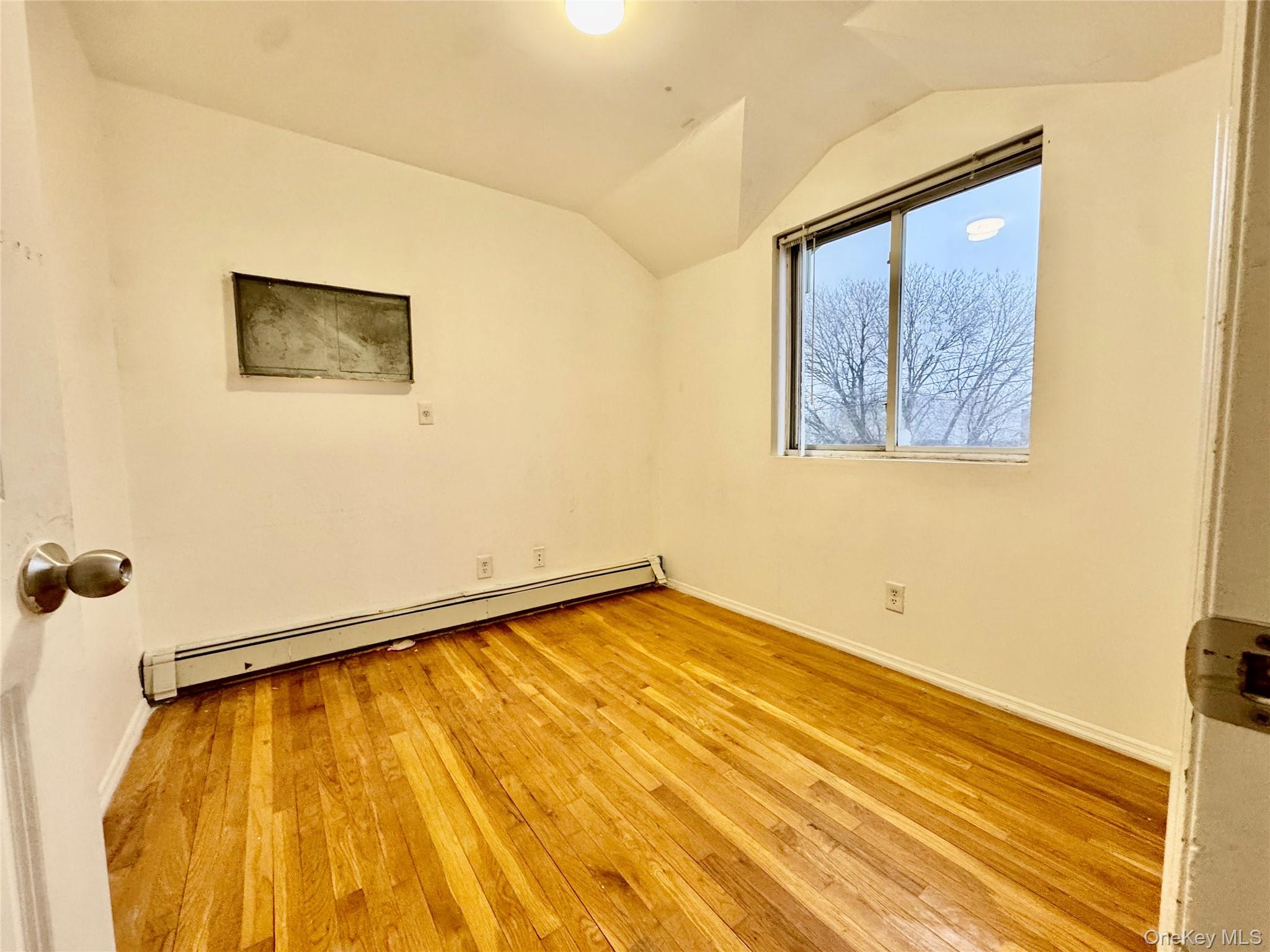 103-25 Alstyne Avenue Queens, NY 11368 - Photo 13 of 22 a view of a room with wooden floor and small space
