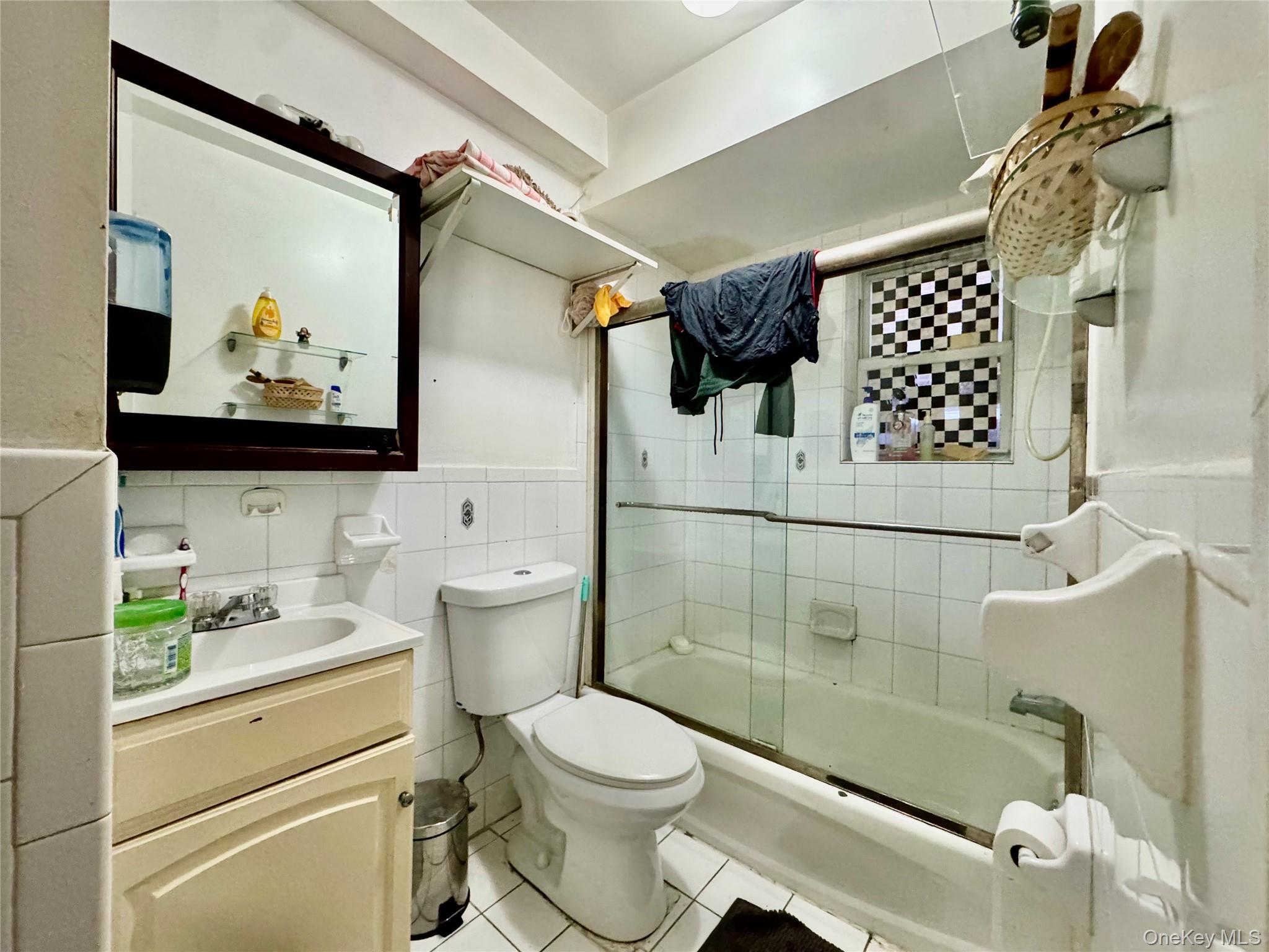 103-25 Alstyne Avenue Queens, NY 11368 - Photo 17 of 22 a bathroom with a sink toilet and shower