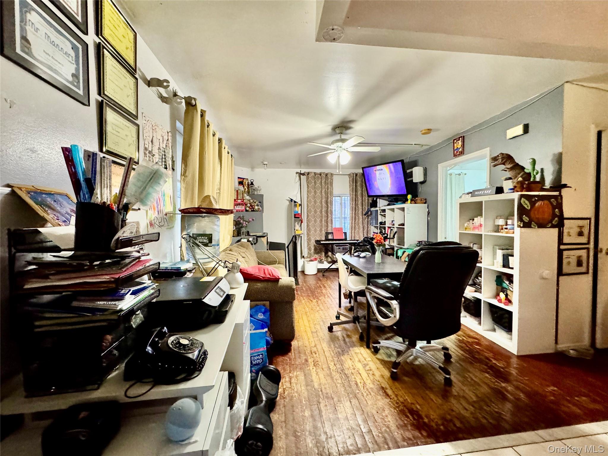 103-25 Alstyne Avenue Queens, NY 11368 - Photo 21 of 22 a living room with furniture and a flat screen tv