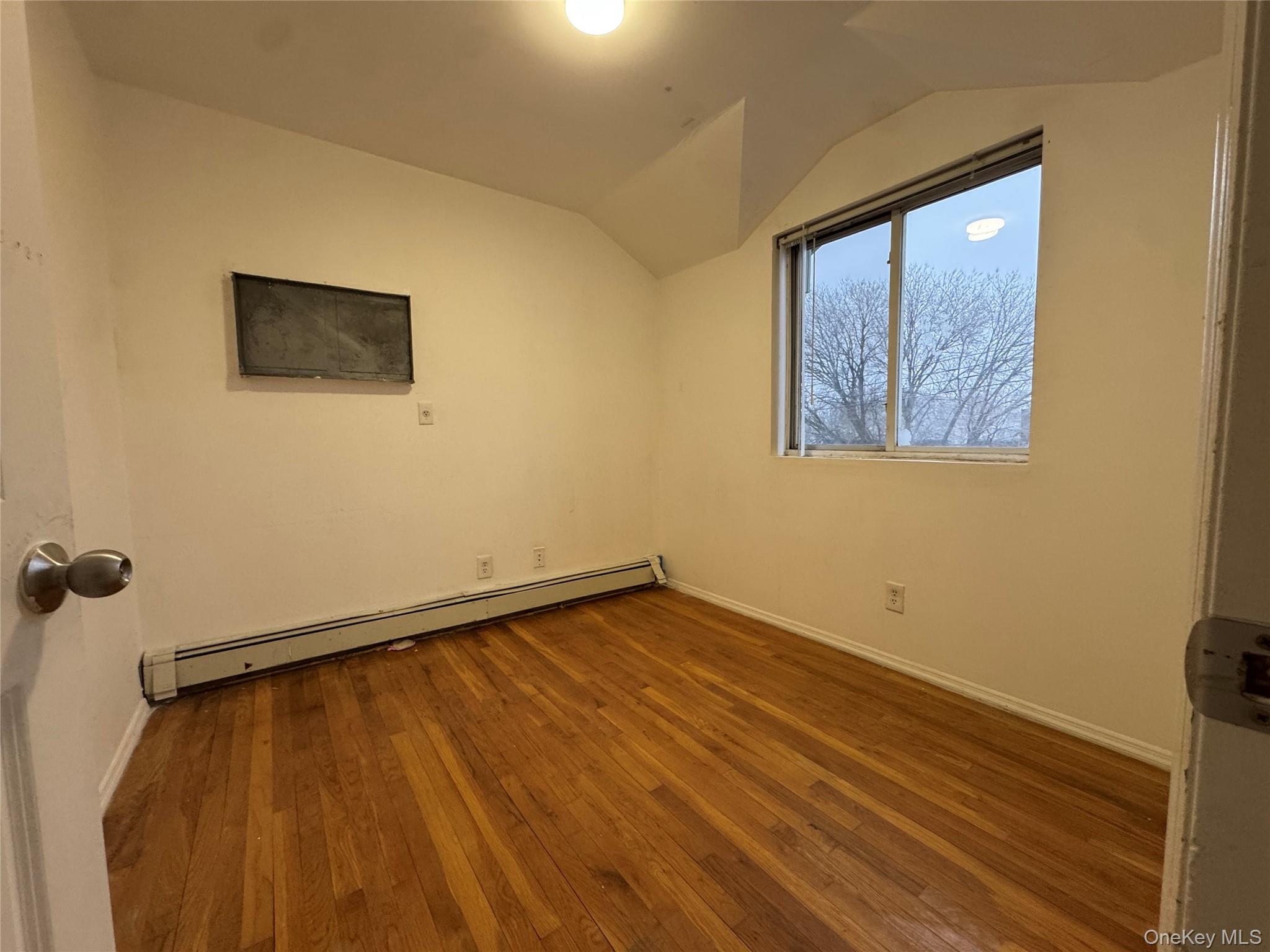 103-25 Alstyne Avenue Queens, NY 11368 - Photo 5 of 22 a view of an empty room with a window