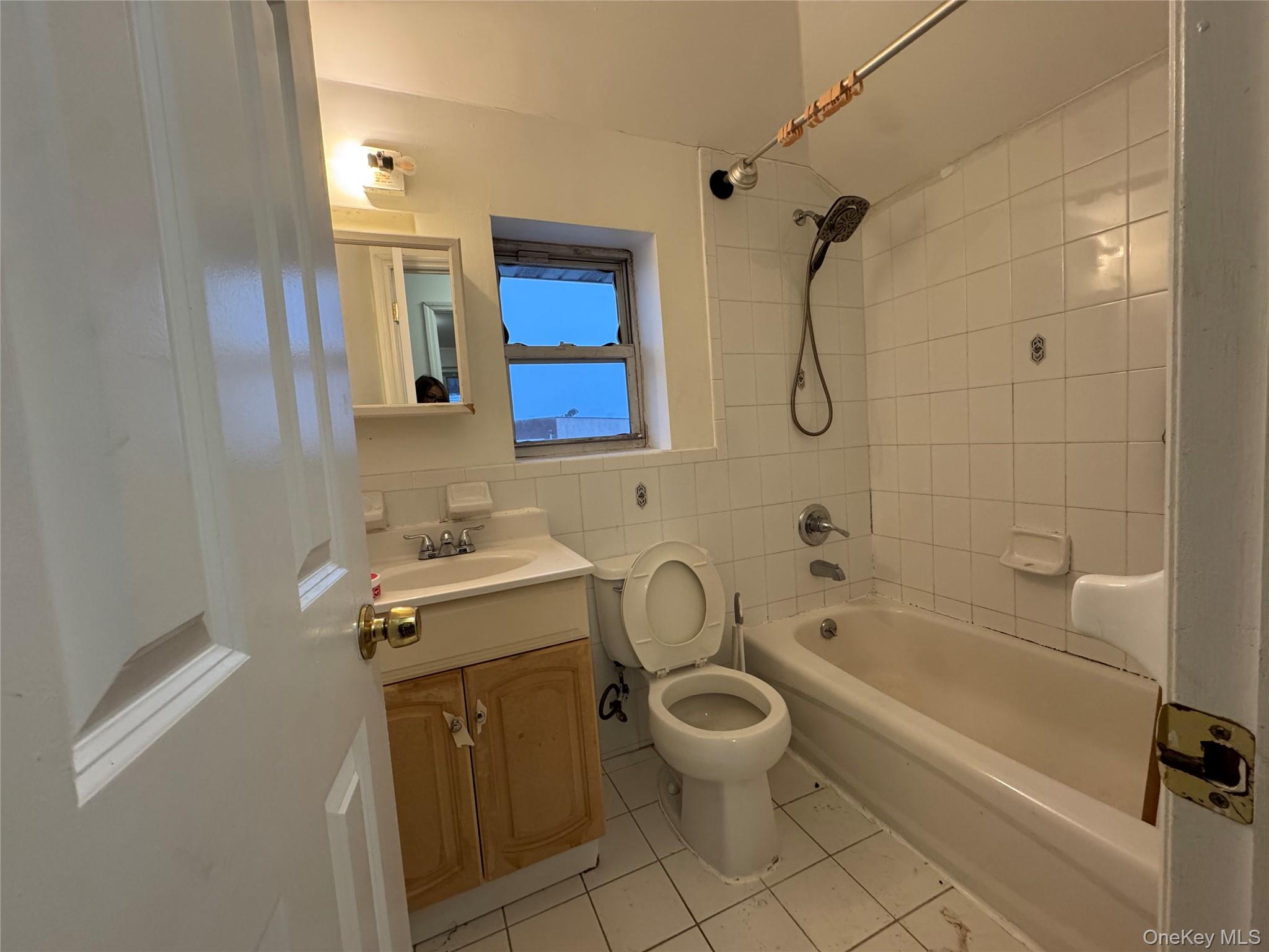 103-25 Alstyne Avenue Queens, NY 11368 - Photo 7 of 22 a bathroom with a sink toilet and shower
