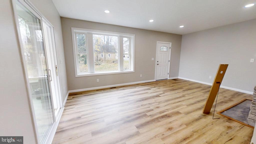 10 Linden Street Bridgeton, NJ 08302 - Photo 20 of 89 a view of an empty room with wooden floor and a window