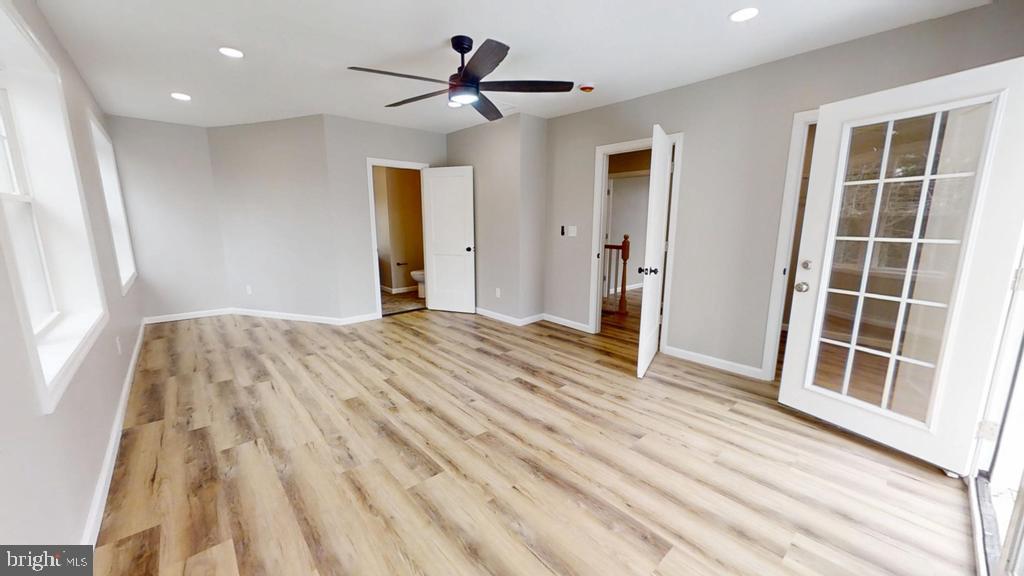 10 Linden Street Bridgeton, NJ 08302 - Photo 24 of 89 a view of empty room with wooden floor and fan