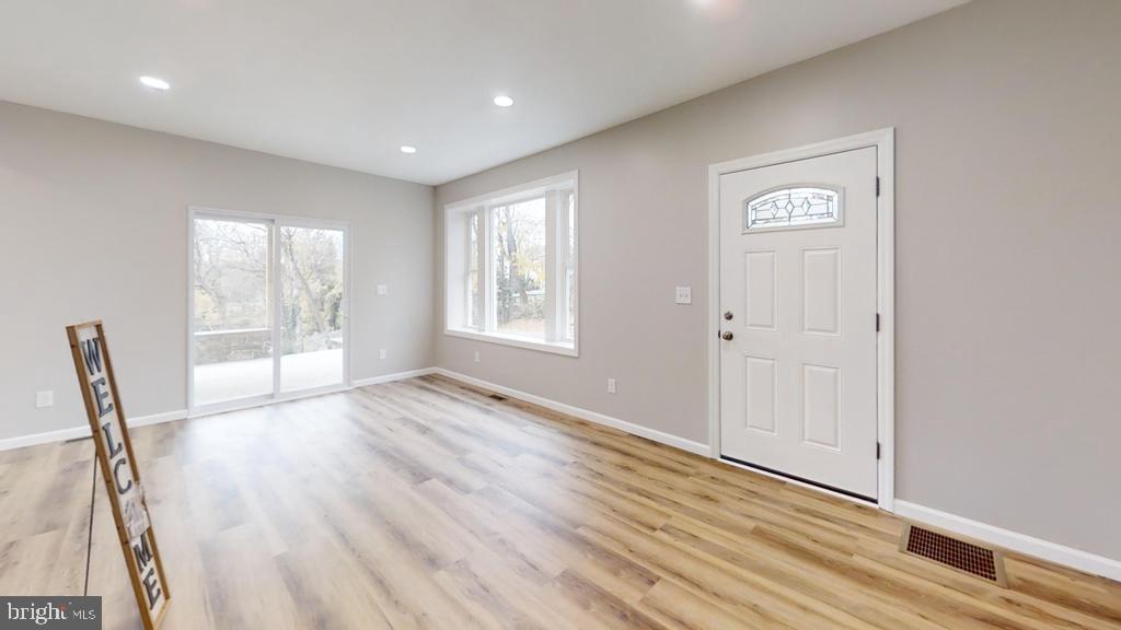 10 Linden Street Bridgeton, NJ 08302 - Photo 37 of 89 a view of empty room with wooden floor and fan