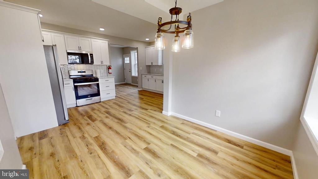 10 Linden Street Bridgeton, NJ 08302 - Photo 44 of 89 a view of a kitchen with kitchen island wooden floor center island and stainless steel appliances