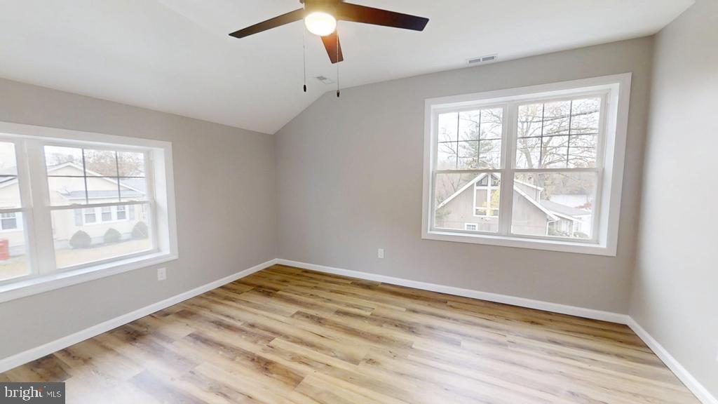 10 Linden Street Bridgeton, NJ 08302 - Photo 52 of 89 a view of an empty room with wooden floor and a window