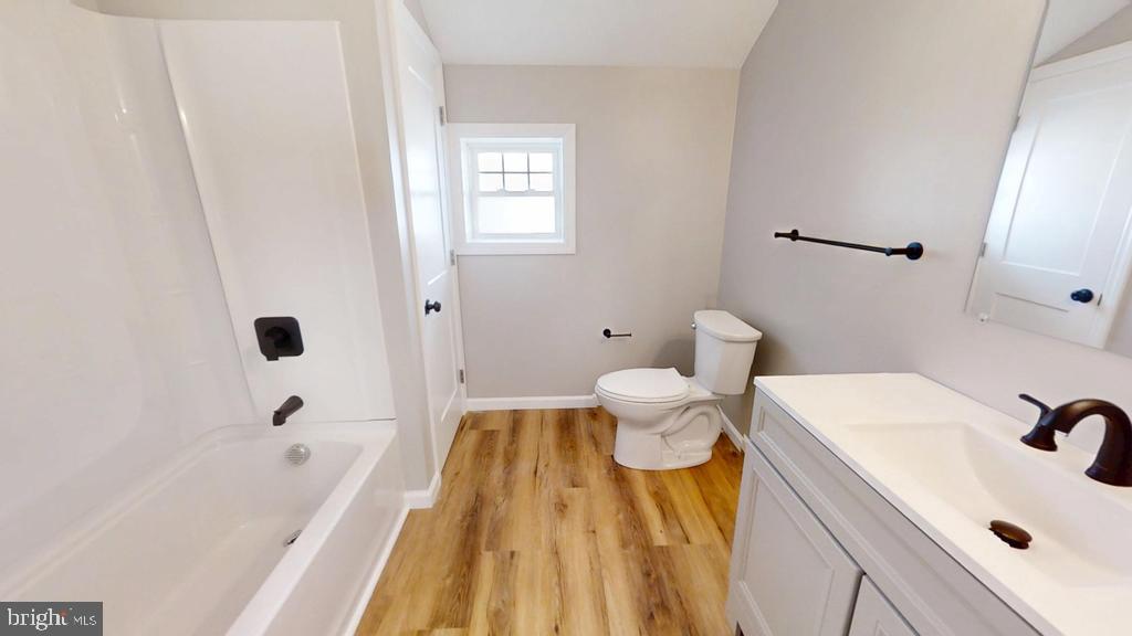 10 Linden Street Bridgeton, NJ 08302 - Photo 54 of 89 a bathroom with a sink a toilet and shower