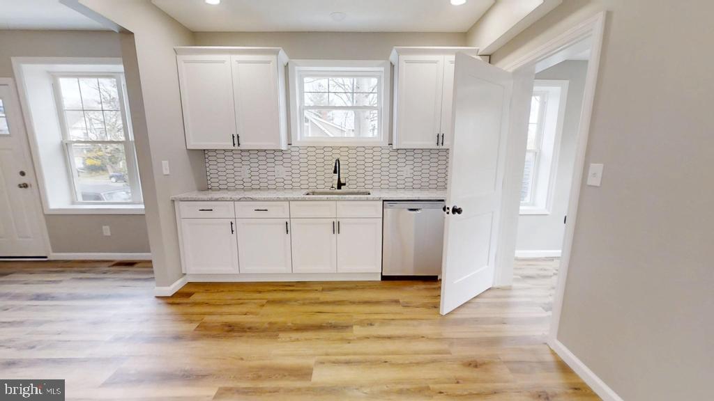 10 Linden Street Bridgeton, NJ 08302 - Photo 10 of 89 a view of a kitchen with wooden floor and a sink