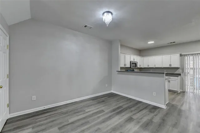 a view of kitchen with wooden floor
