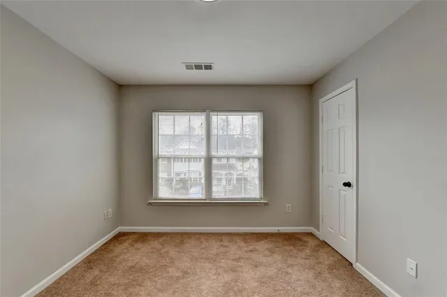 a view of an empty room and window