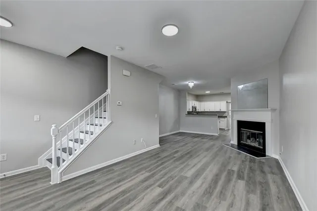 a view of an empty room and fire place