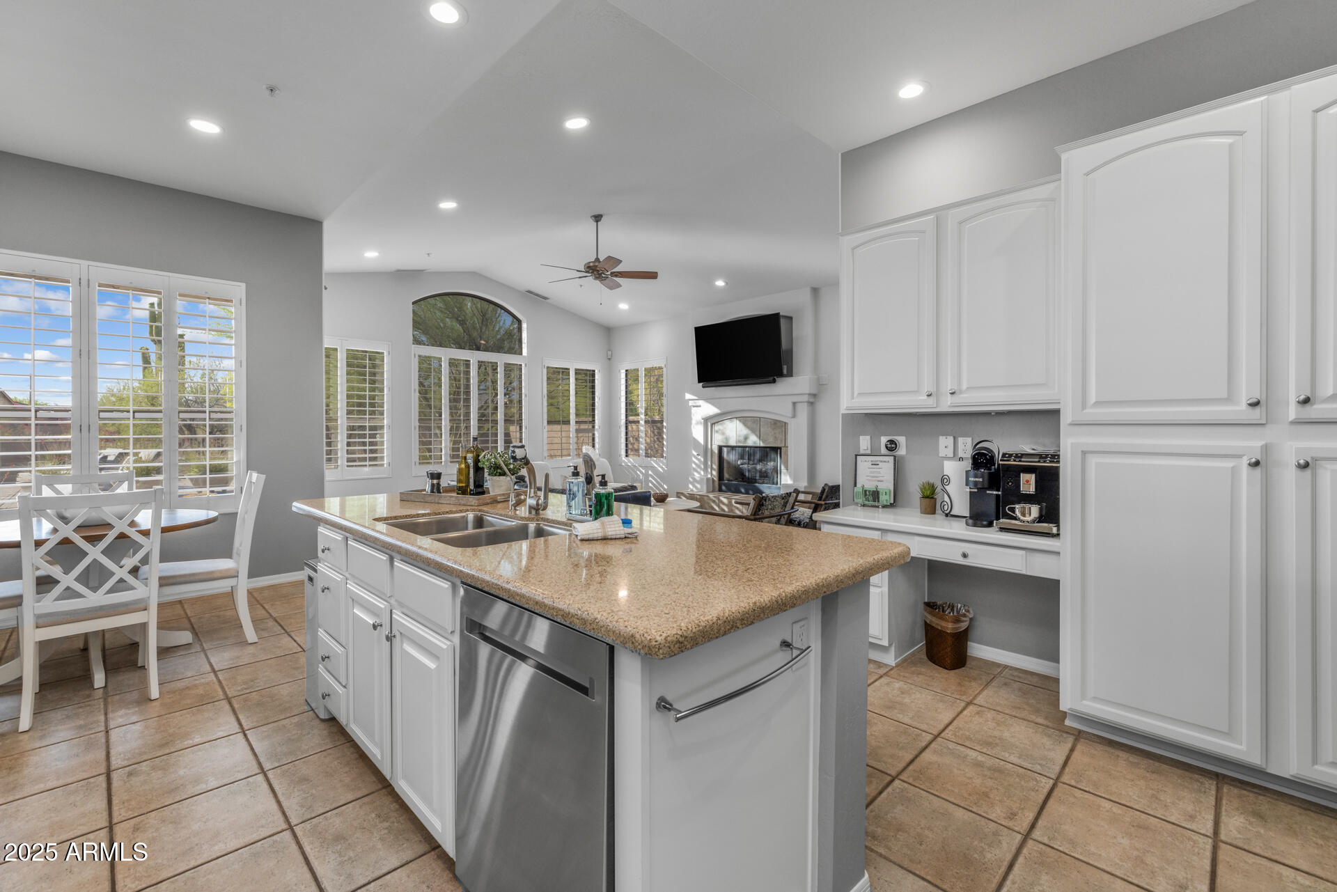 7474 East Red Bird Road Scottsdale, AZ 85266 - Photo 12 of 40 a kitchen with a sink stove and cabinets