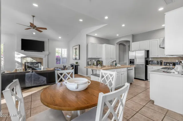a living room with furniture fireplace and a flat screen tv
