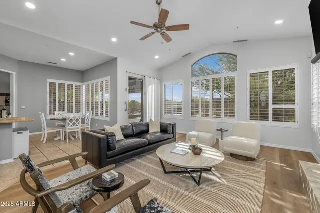 a spacious bedroom with a large bed and a large window