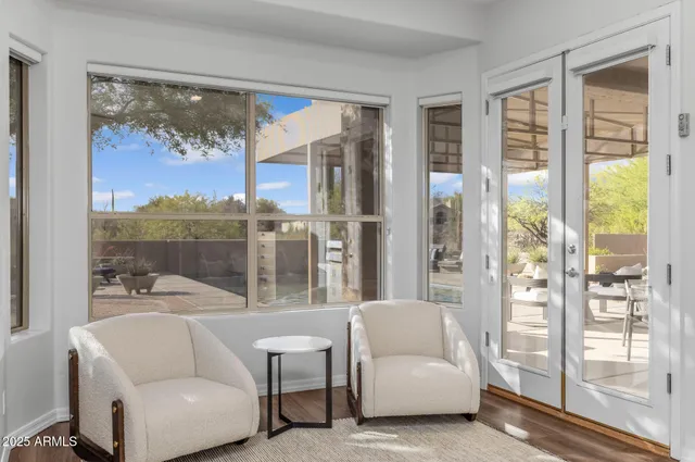 a bedroom with a bed couch and window